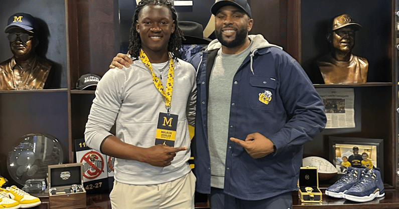 Malachi Zeigler with Sherrone Moore